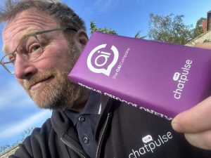 Darren Ford holding The CAI Company and Chatpulse branded chocolate
